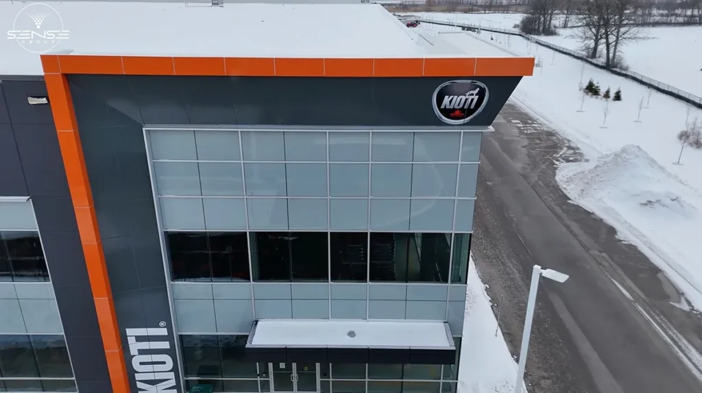Aerial front view of Kioti commercial building in Milton Ontario during professional security camera installation project by Sense Group