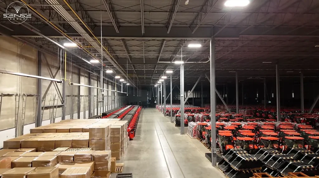 Interior view of large warehouse in Ontario with rows of equipment and inventory during commercial security camera installation project by Sense Group