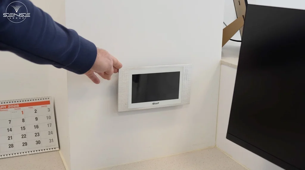 Wall mounted video intercom monitor installed inside commercial office for access control and door entry management in Ontario